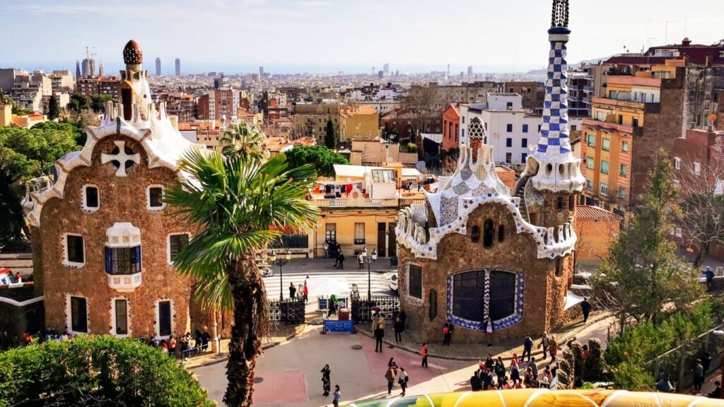 Best cities to visit in Europe: Whimsical architecture of Park Güell with the city of Barcelona in the background.